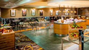 A hotel lobby with a central fruit display, seating areas, and a reception desk. - The Park Royal Hotel & Spa (Warrington)