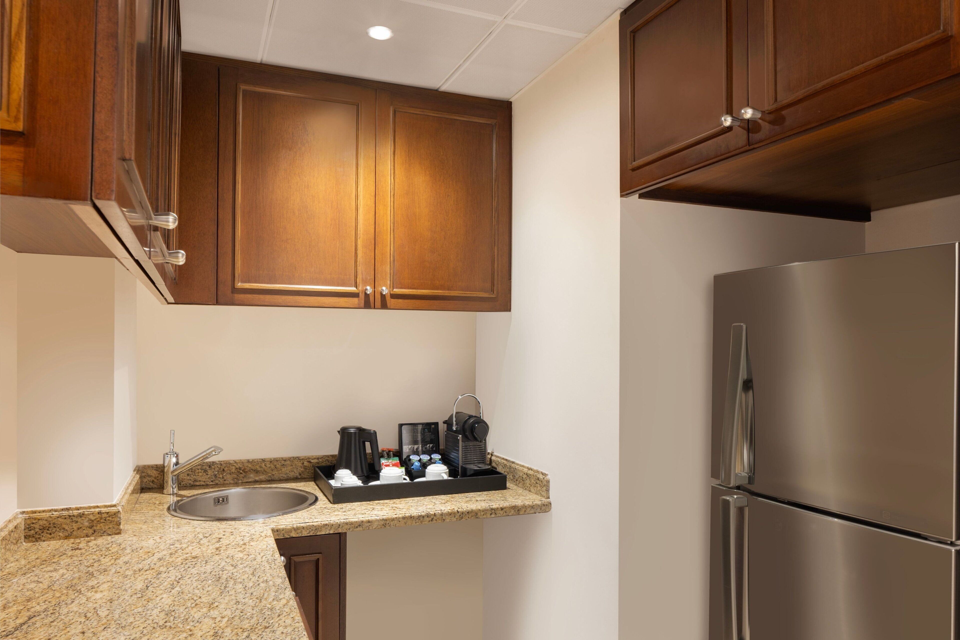 mini-fridge, coffee/tea maker, electric kettle, high chair