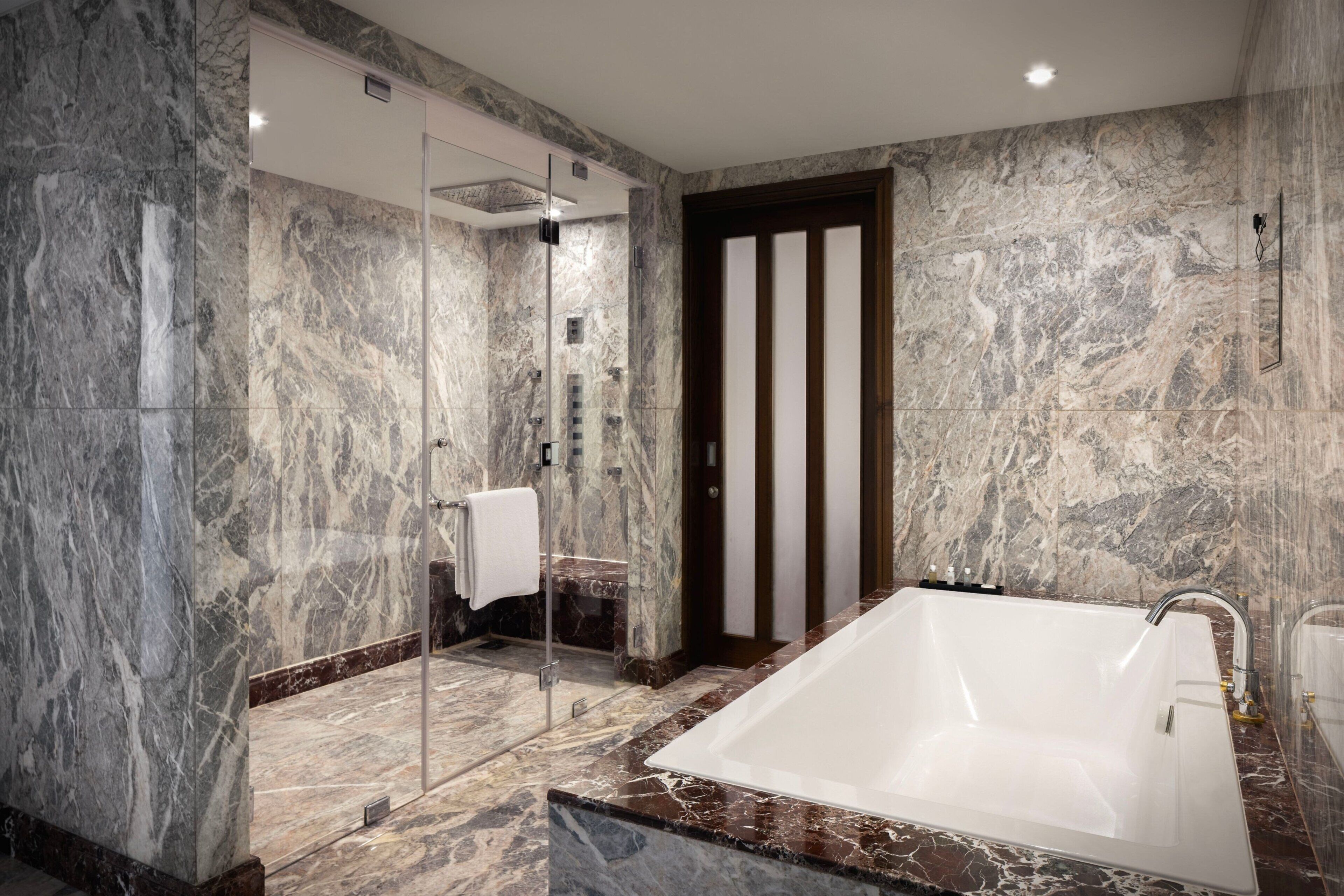 royal suite, 1 king bed, non smoking | bathroom | combined shower/bathtub, designer toiletries, hair dryer, bathrobes