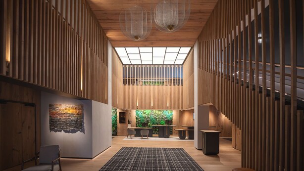 A spacious lobby with wooden paneling, a central seating area, and a large green wall with plants. - Best Western Premier Hôtel de la Paix (Reims)
