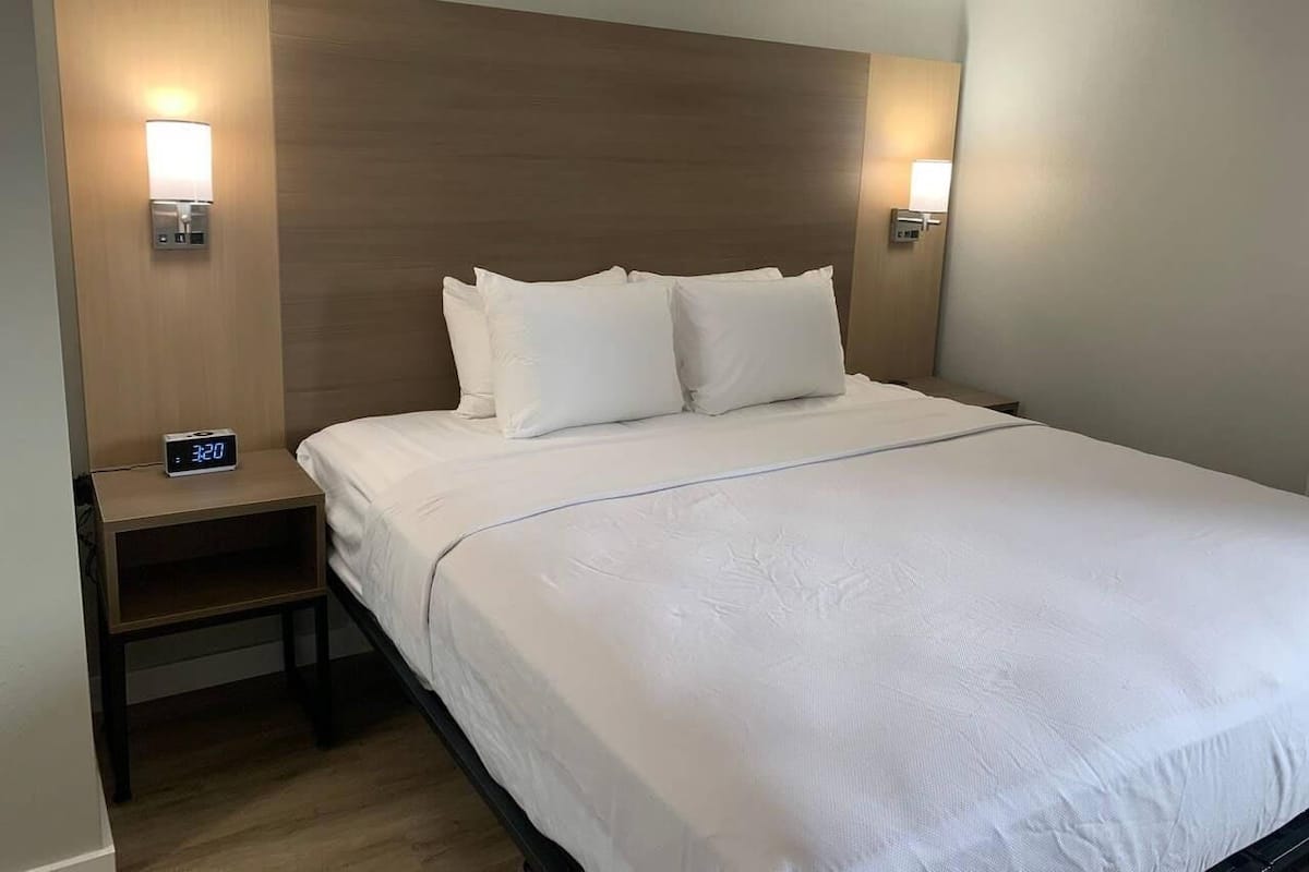 Premium bedding, blackout curtains, iron/ironing board, free WiFi