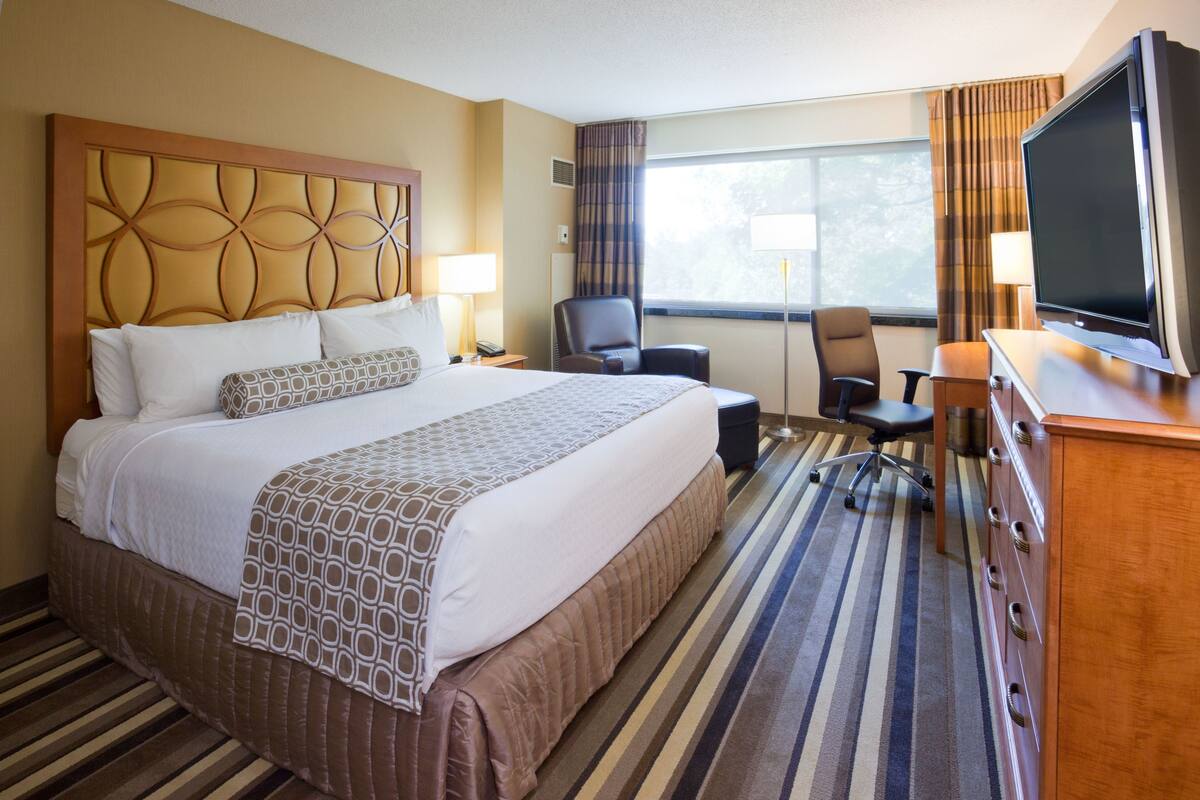 Premium bedding, desk, laptop workspace, soundproofing