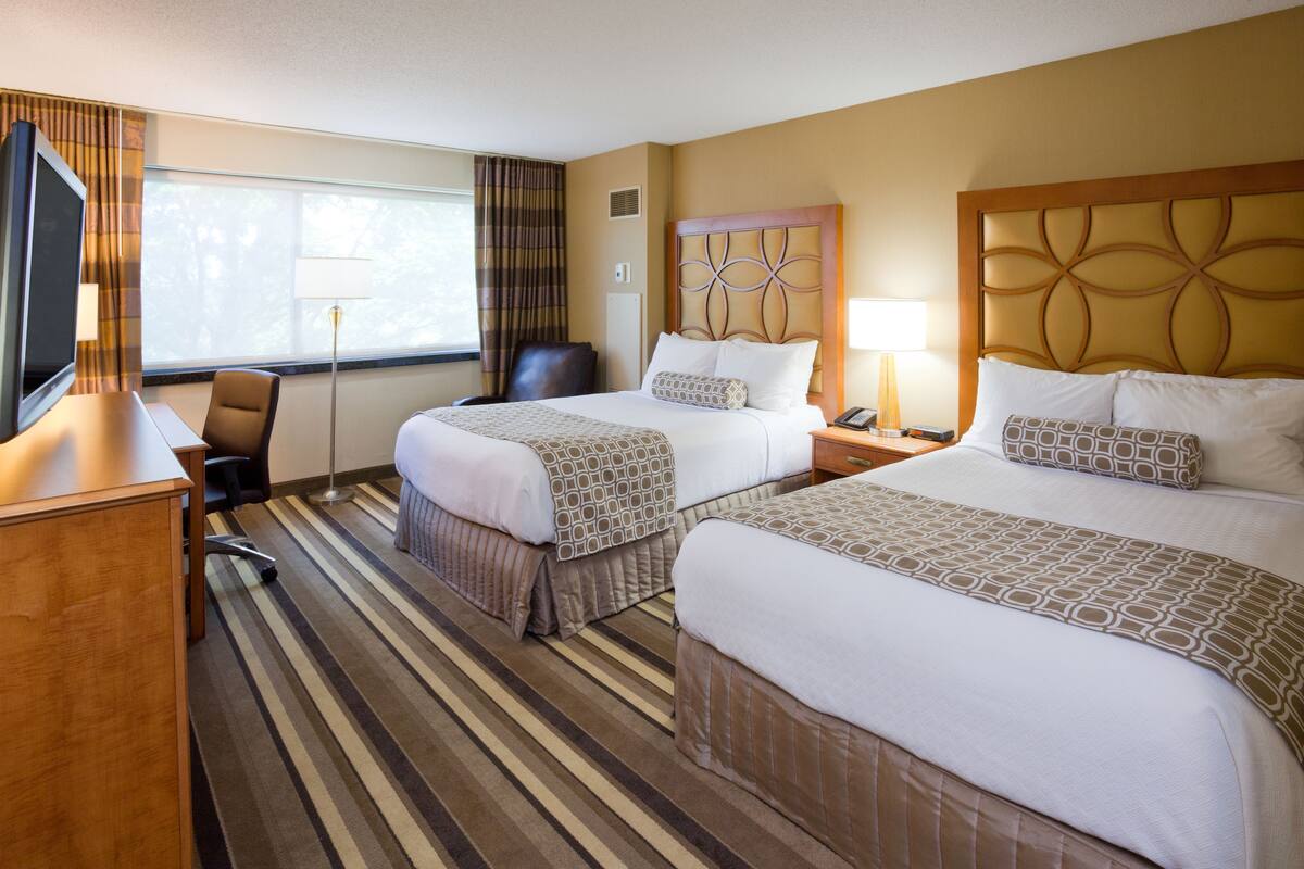 Premium bedding, desk, laptop workspace, soundproofing