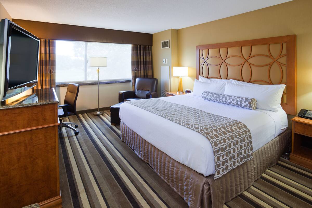Premium bedding, desk, laptop workspace, soundproofing