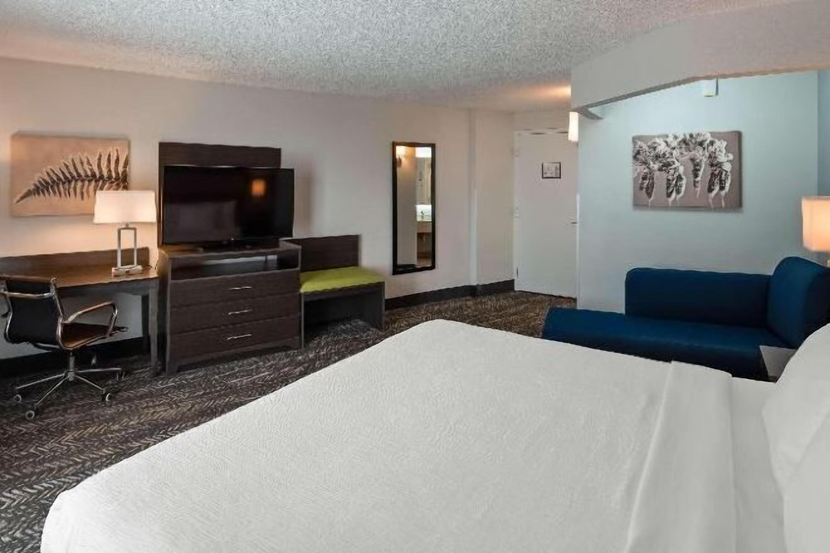 Desk, laptop workspace, blackout drapes, iron/ironing board