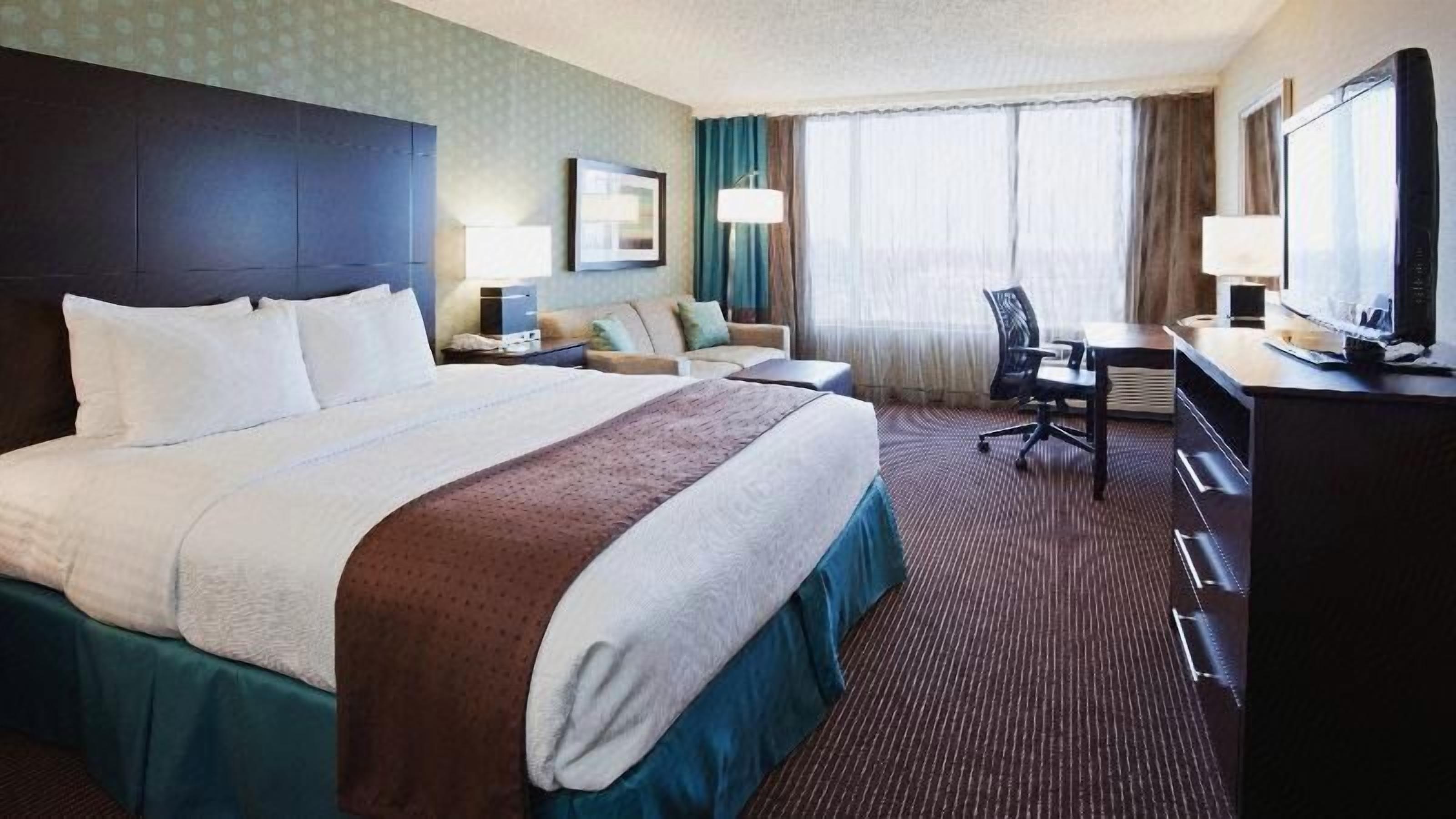 Premium bedding, down duvets, pillow-top beds, in-room safe