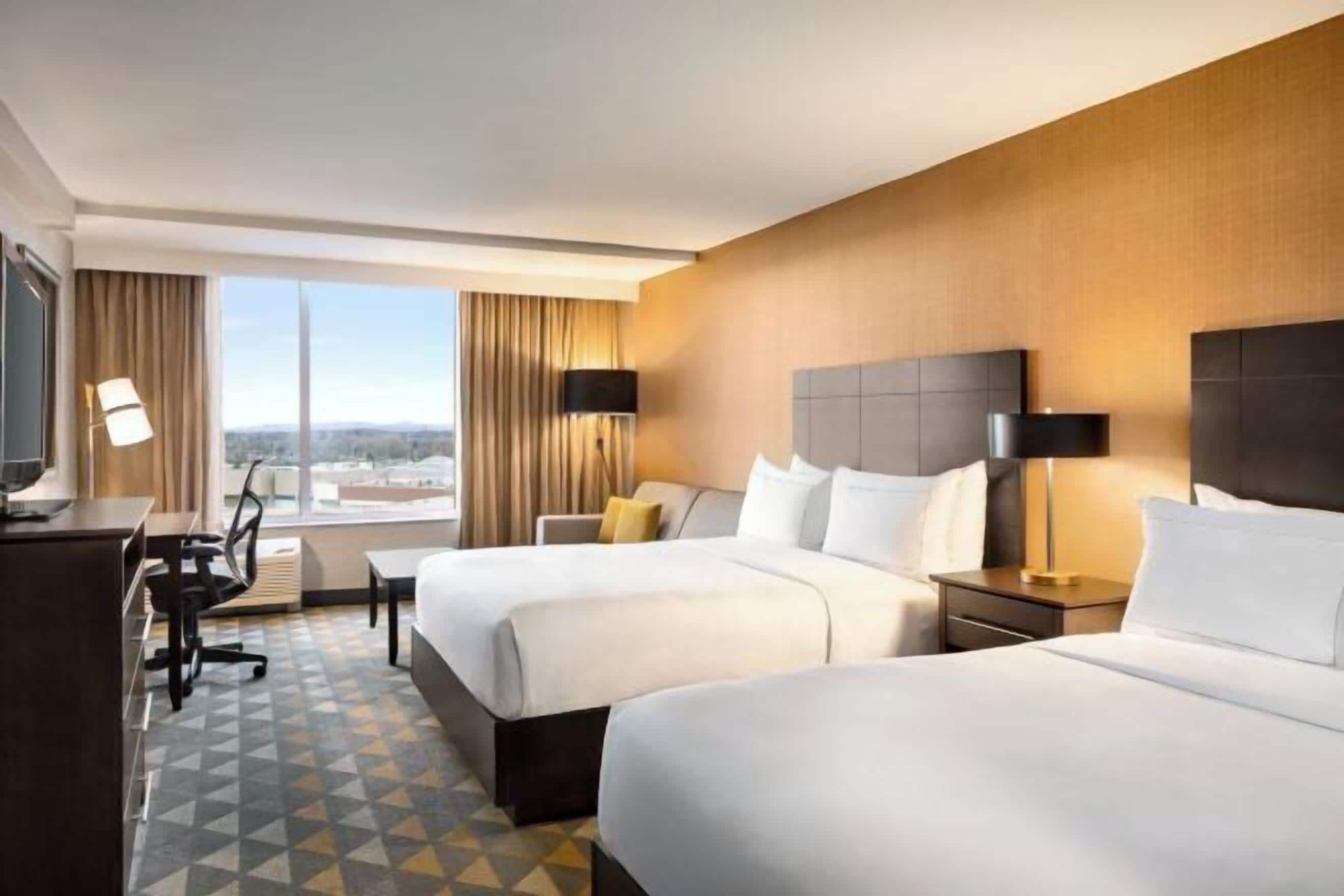 Premium bedding, down duvets, pillow-top beds, in-room safe