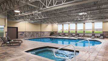 Indoor pool, open 7:00 AM to 11:00 PM, pool loungers