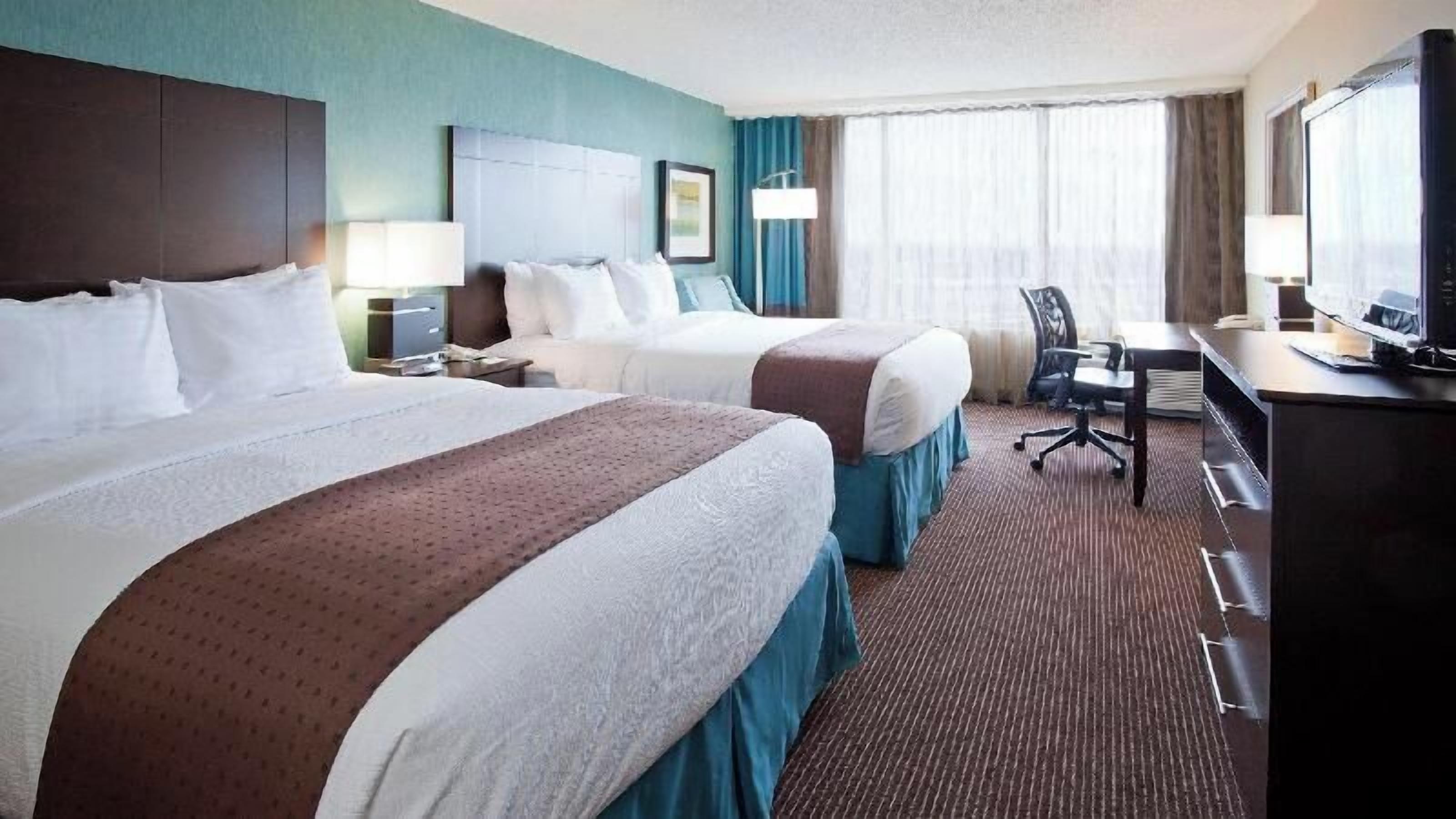 Premium bedding, down duvets, pillow-top beds, in-room safe