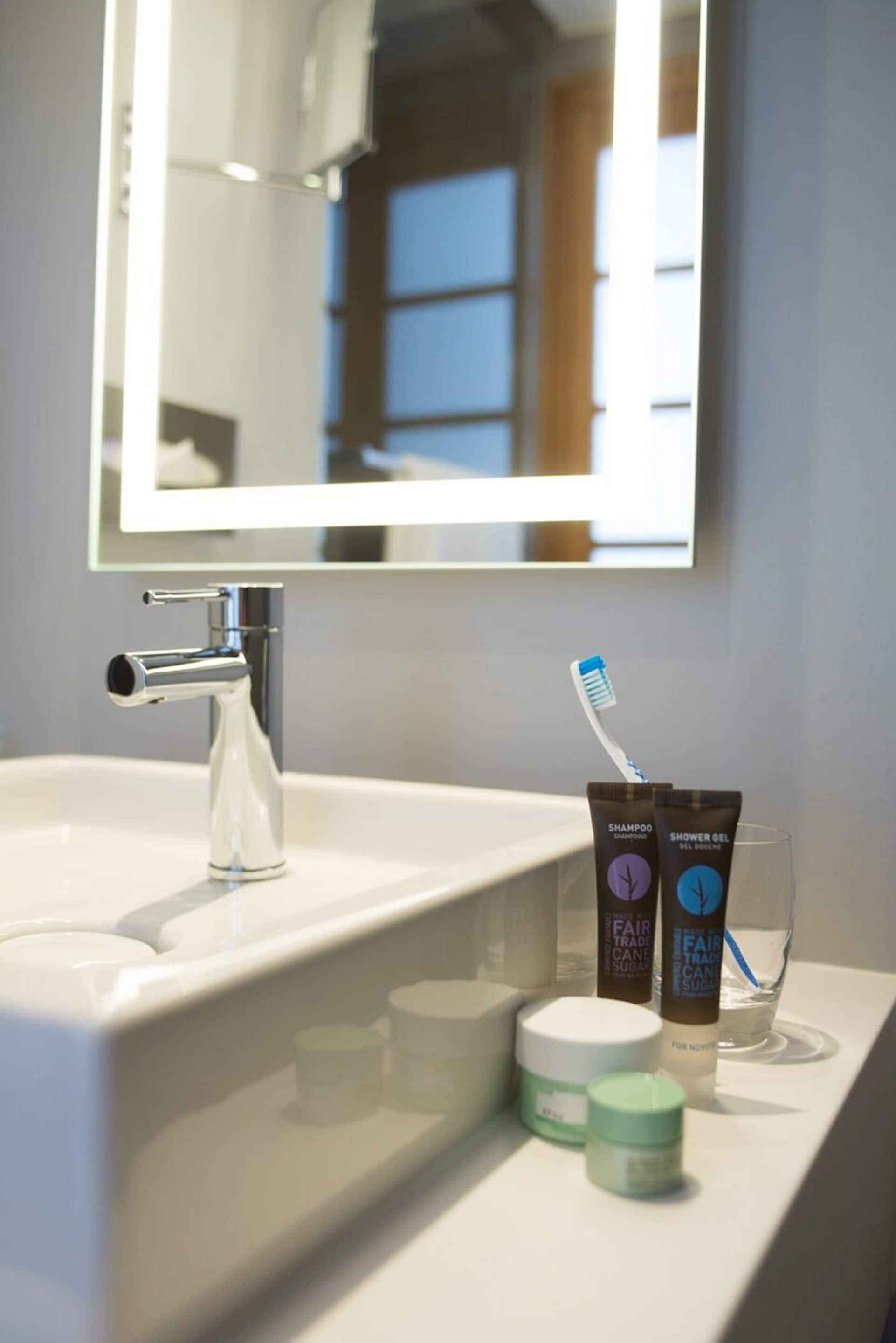 eco-friendly toiletries, hair dryer, towels, soap