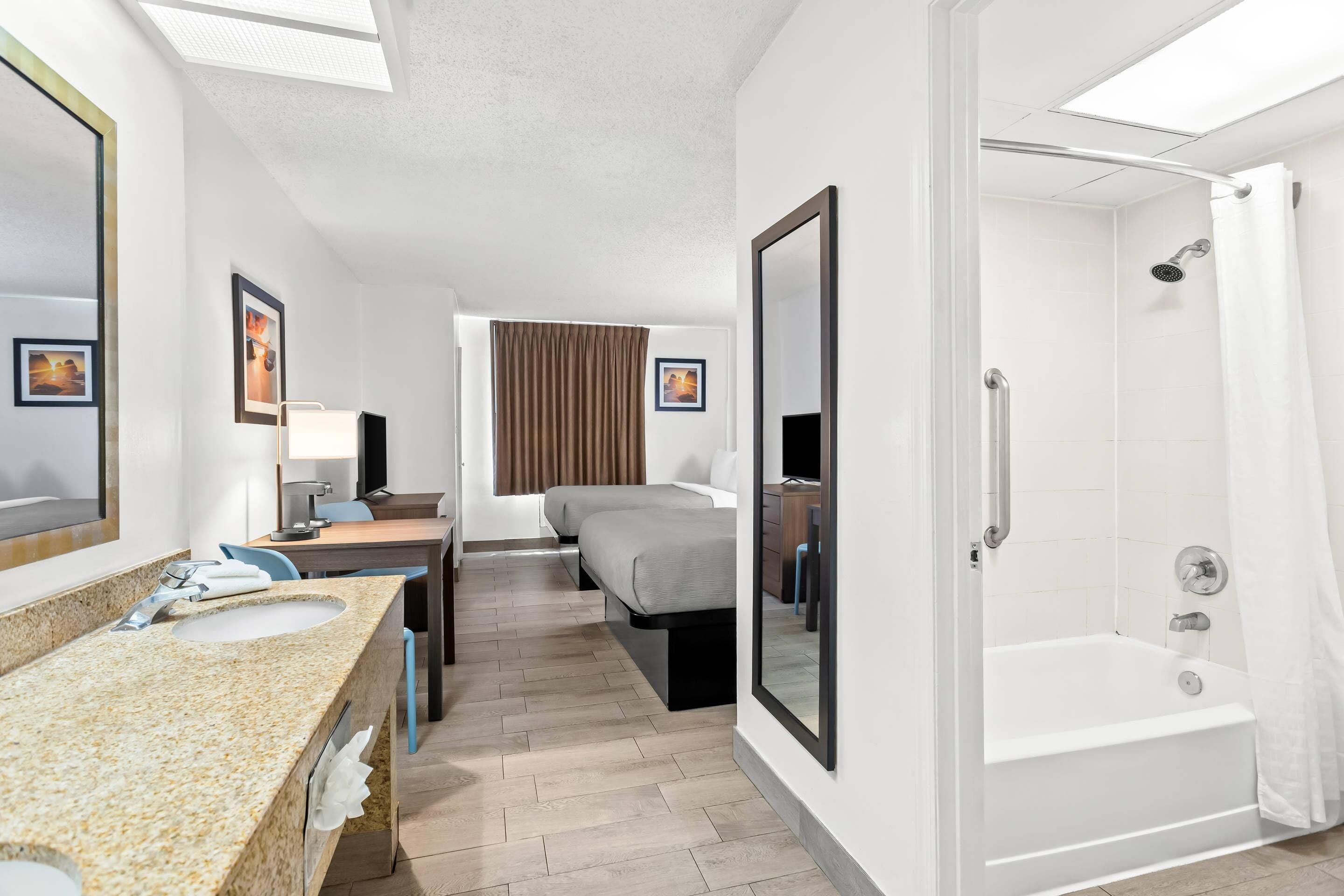 Suite, Multiple Beds, Non Smoking | Bathroom | Combined shower/bathtub, hair dryer, towels