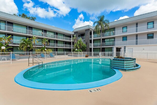 Outdoor pool, open 9:00 AM to 9:00 PM, pool umbrellas, pool loungers