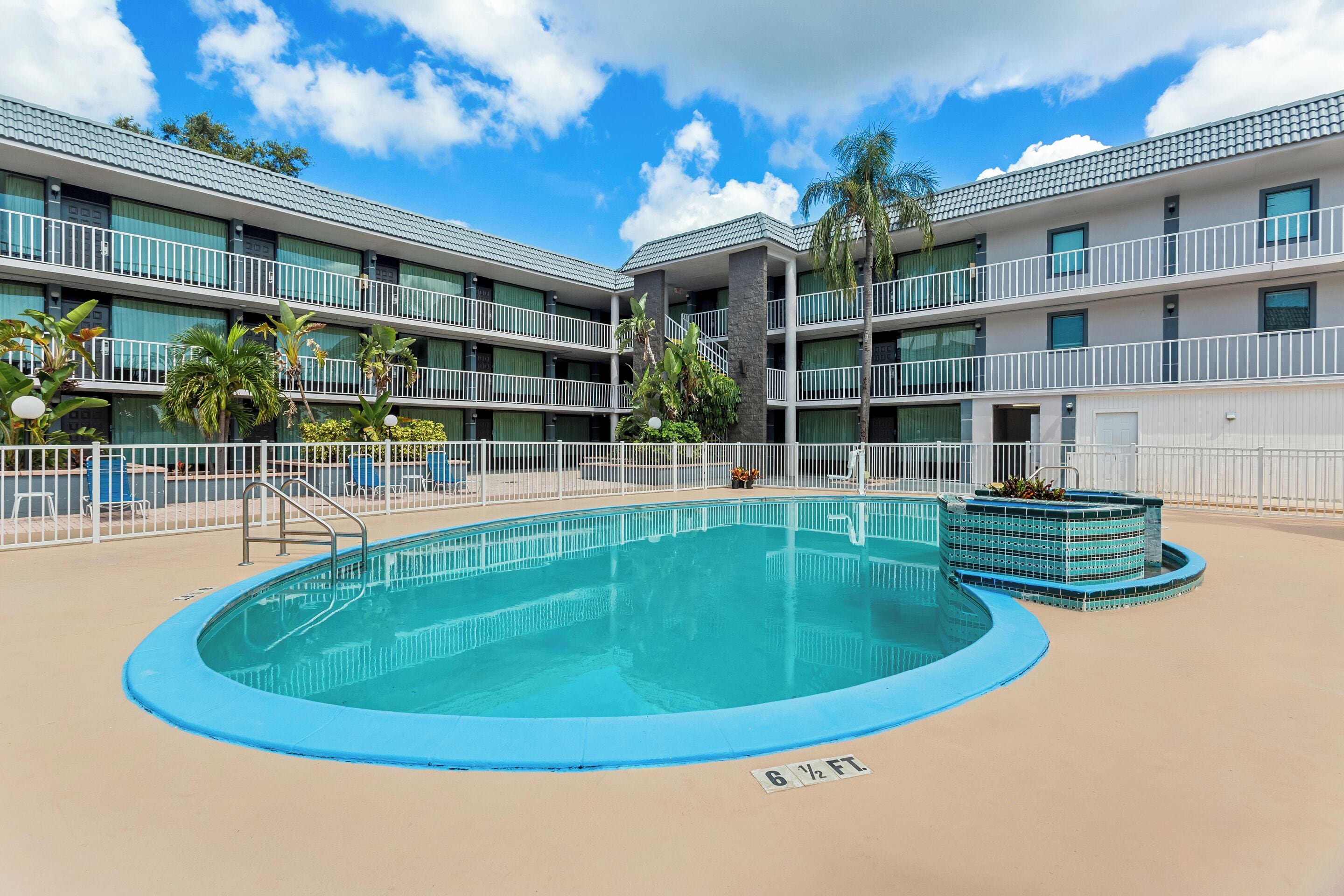 Outdoor pool, open 9:00 AM to 9:00 PM, pool umbrellas, pool loungers