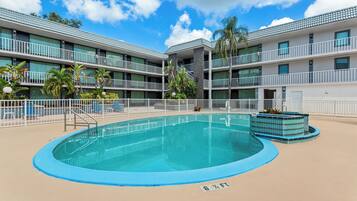 Outdoor pool, open 9:00 AM to 9:00 PM, pool umbrellas, pool loungers