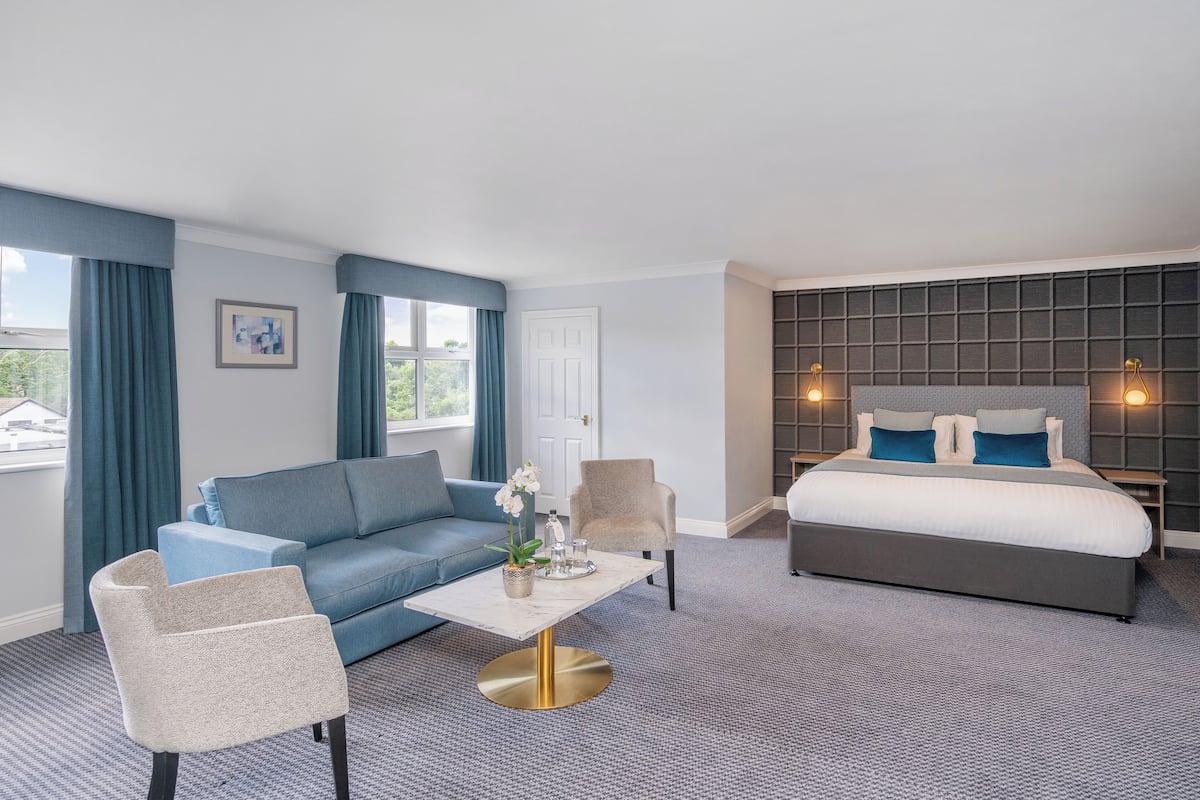 executive double room | in-room safe, desk, laptop workspace, iron/ironing board