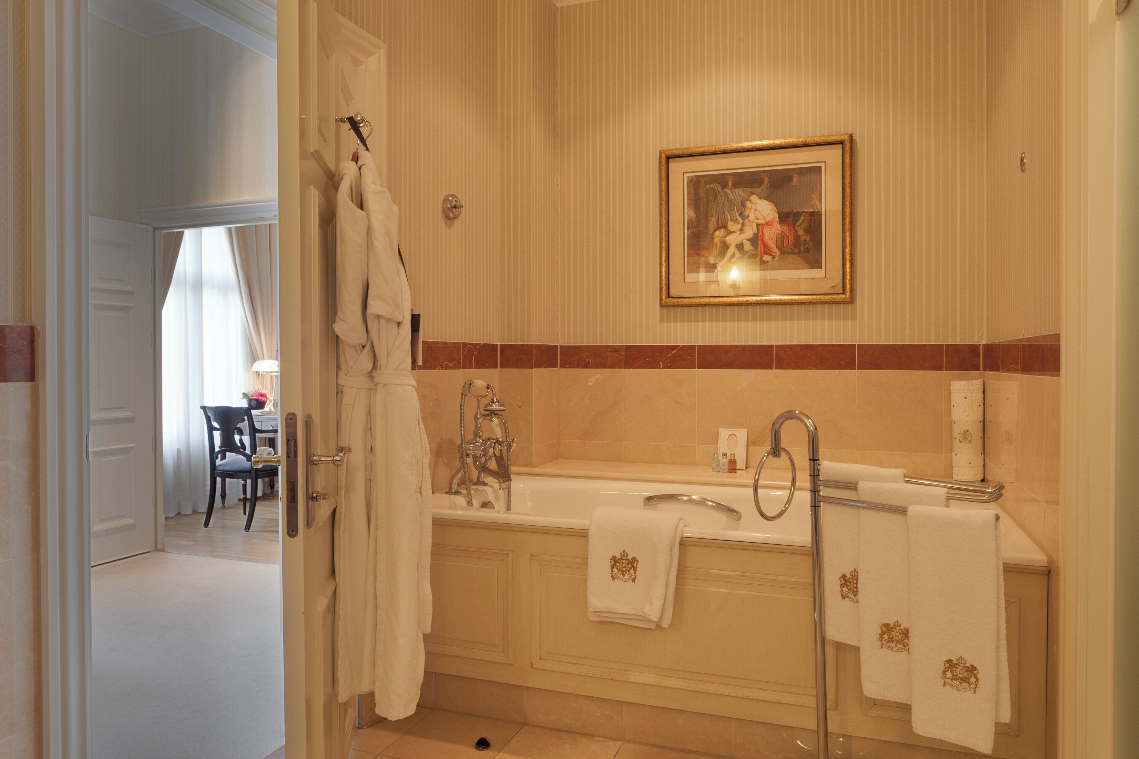 Separate tub and shower, designer toiletries, hair dryer, bathrobes