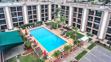 Seasonal outdoor pool, open 8 AM to 8:00 PM, pool umbrellas