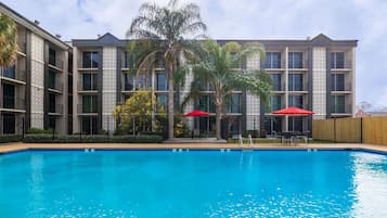 Seasonal outdoor pool, open 8 AM to 8:00 PM, pool umbrellas