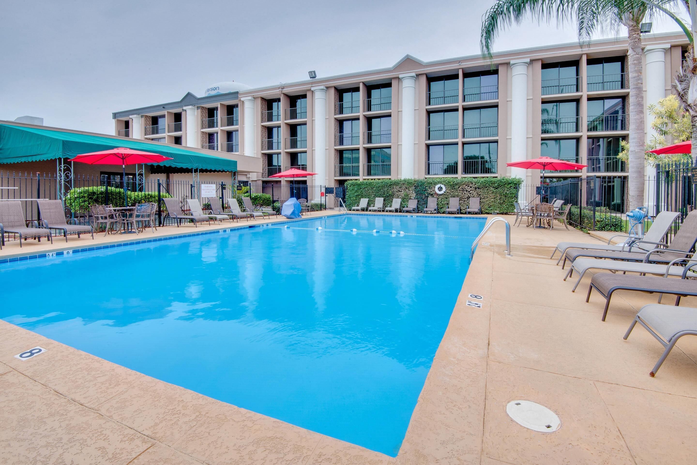 Seasonal outdoor pool, open 8 AM to 8:00 PM, pool umbrellas