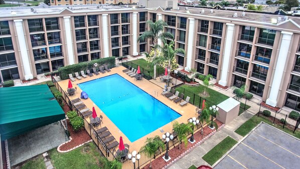 Seasonal outdoor pool, open 8 AM to 8:00 PM, pool umbrellas