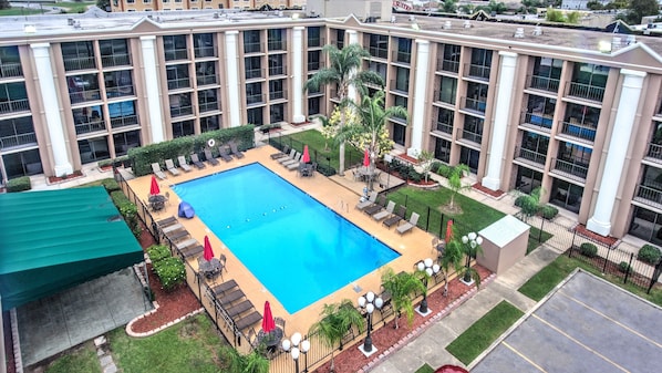 Seasonal outdoor pool, open 8 AM to 8:00 PM, pool umbrellas
