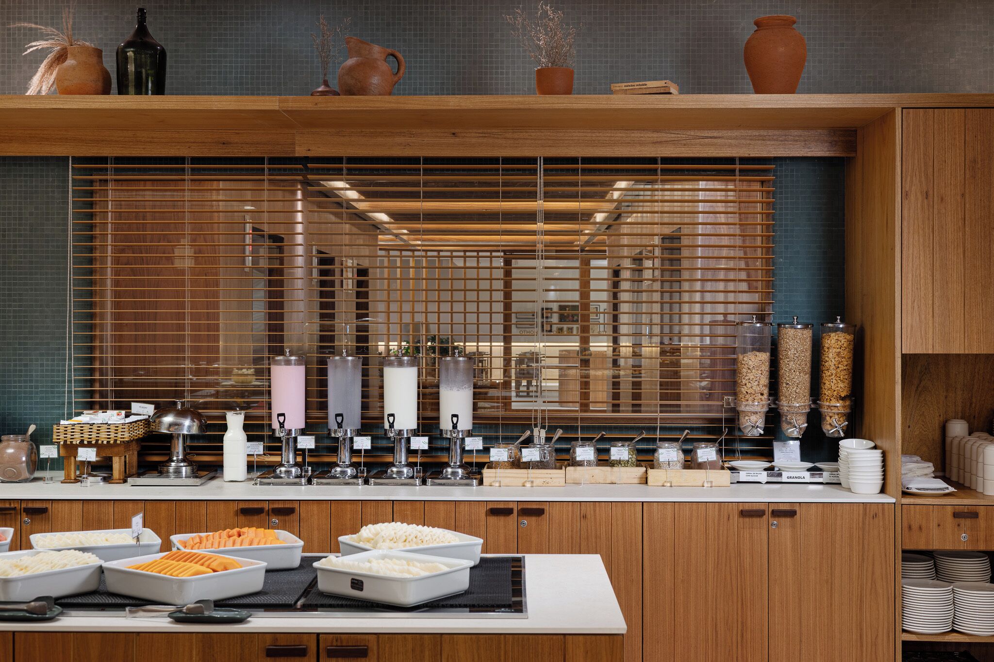 A buffet setup with various food items and condiments.