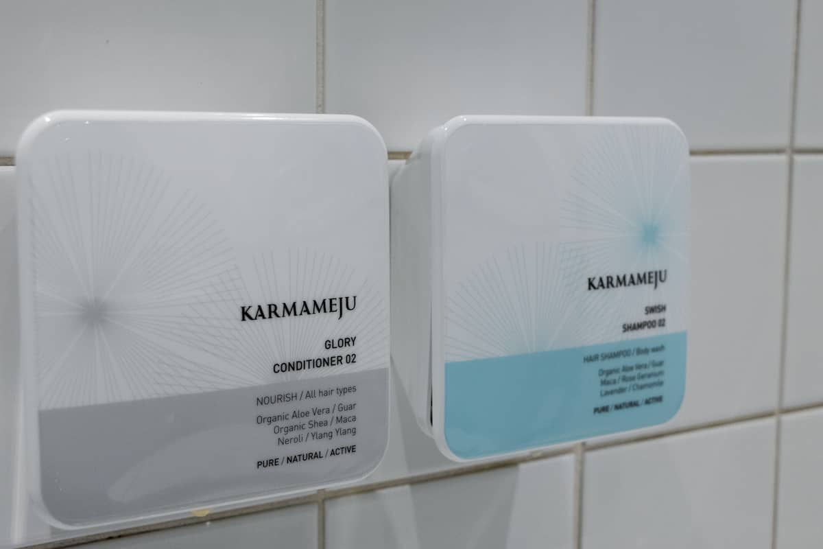 designer toiletries, hair dryer, towels, soap