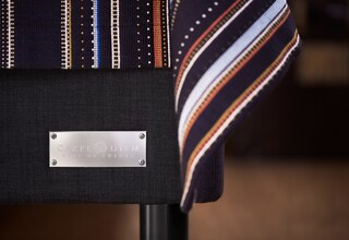 A display of various ties with a label indicating 'CARPE DEMA BEDS OF SWITZERLAND'.