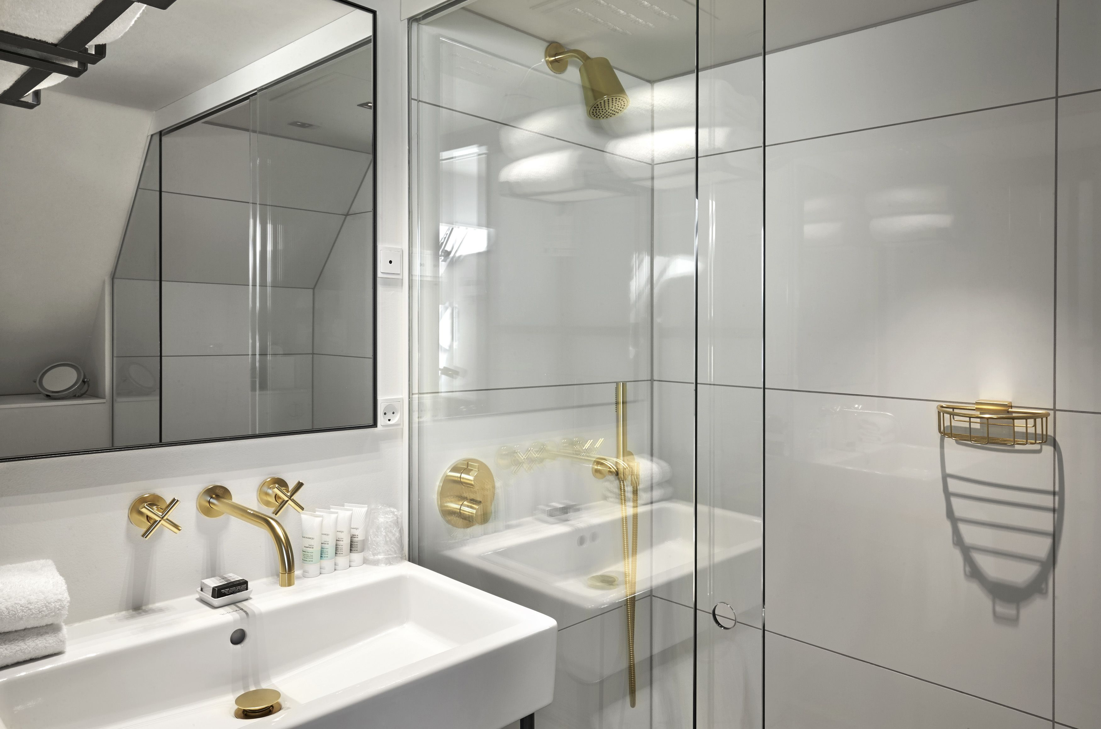 designer toiletries, hair dryer, towels, soap