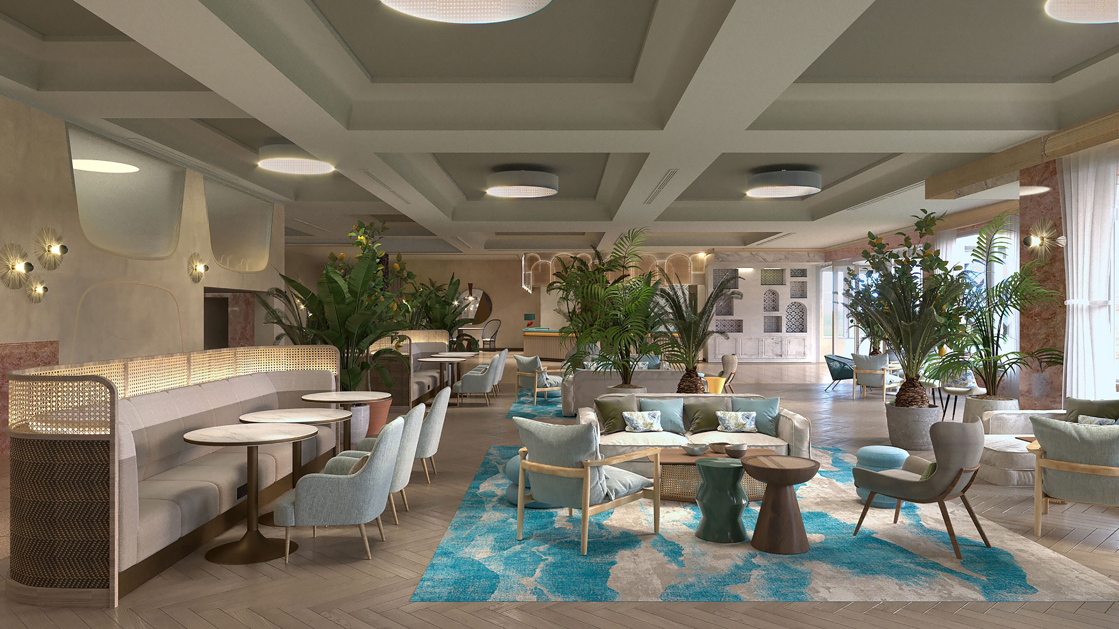 A spacious lobby with seating areas, a coffee bar, and large potted plants.