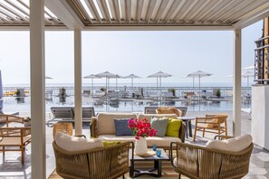 Seasonal outdoor pool, open 9:00 AM to 6:30 PM, pool umbrellas