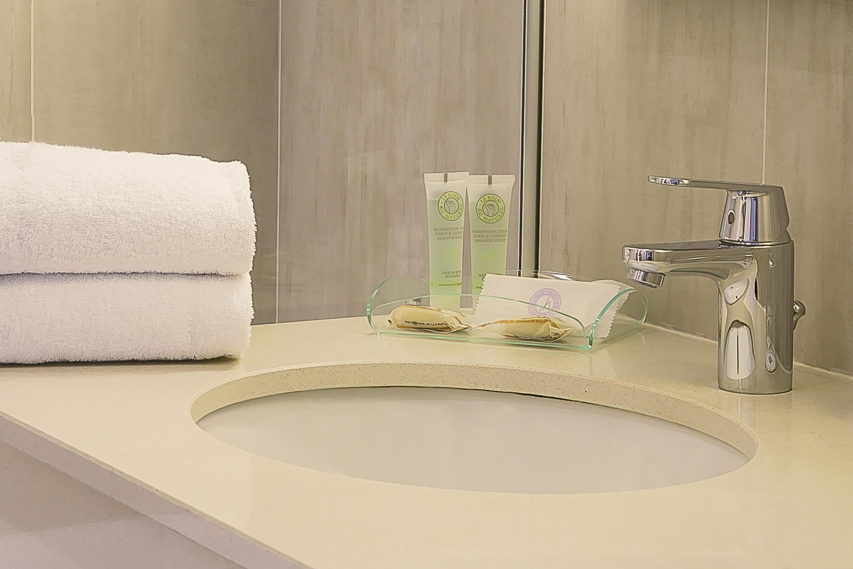 hair dryer, towels, soap, shampoo