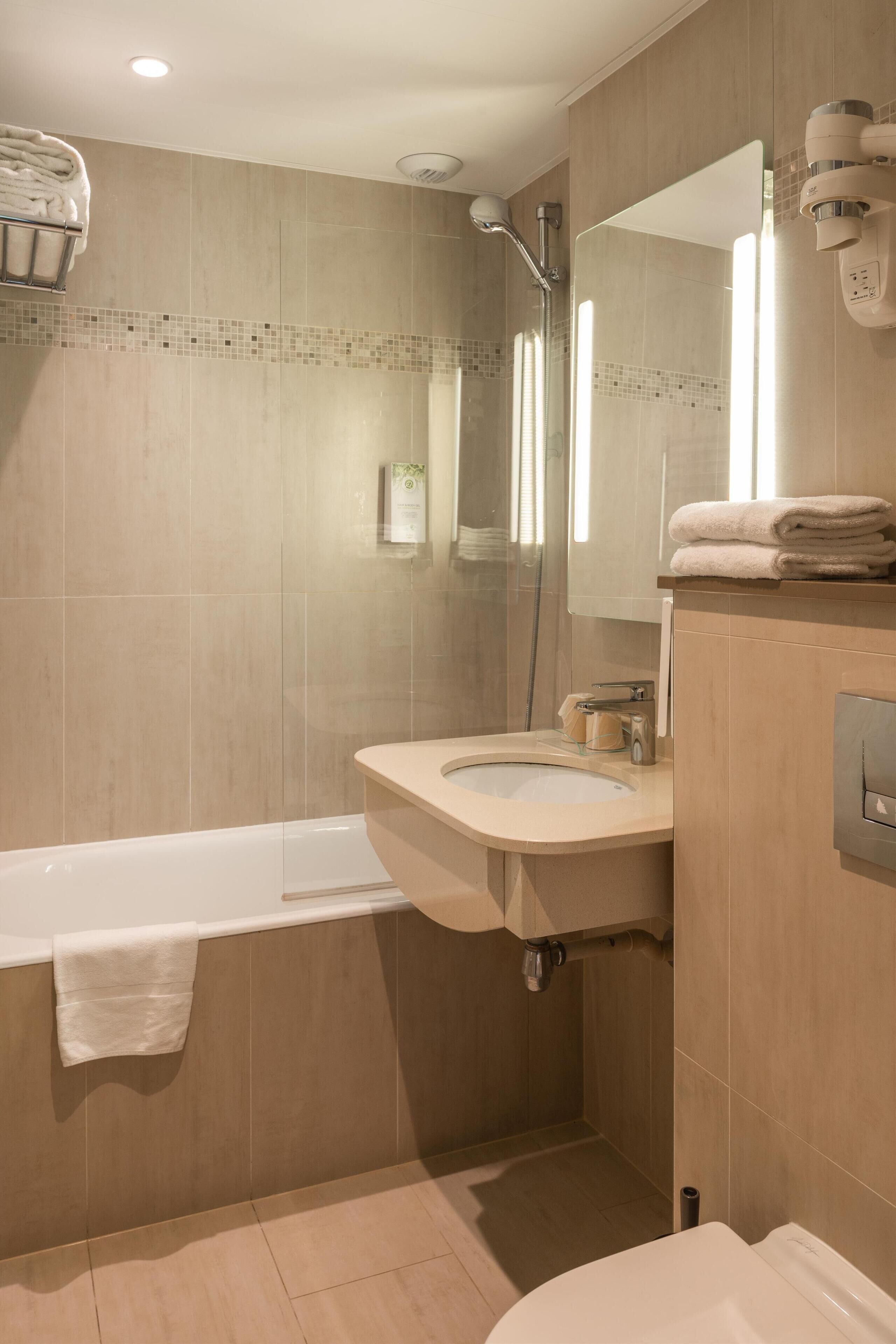 hair dryer, towels, soap, shampoo