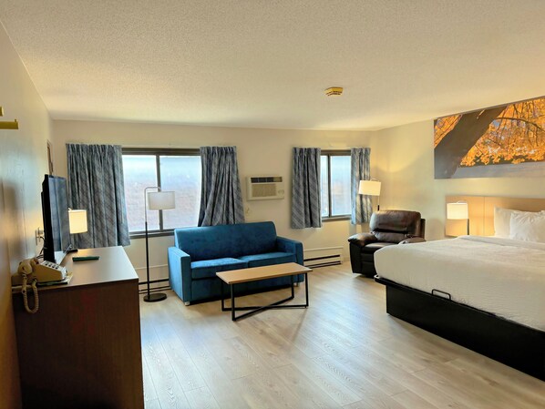 Habitación empresarial, 1 cama King size, refrigerador | Escritorio, cortinas blackout, cunas gratuitas y wifi gratis 