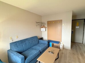 Suite, 1 King Bed, Refrigerator & Microwave | Living area | 42-inch LED TV with cable channels, TV