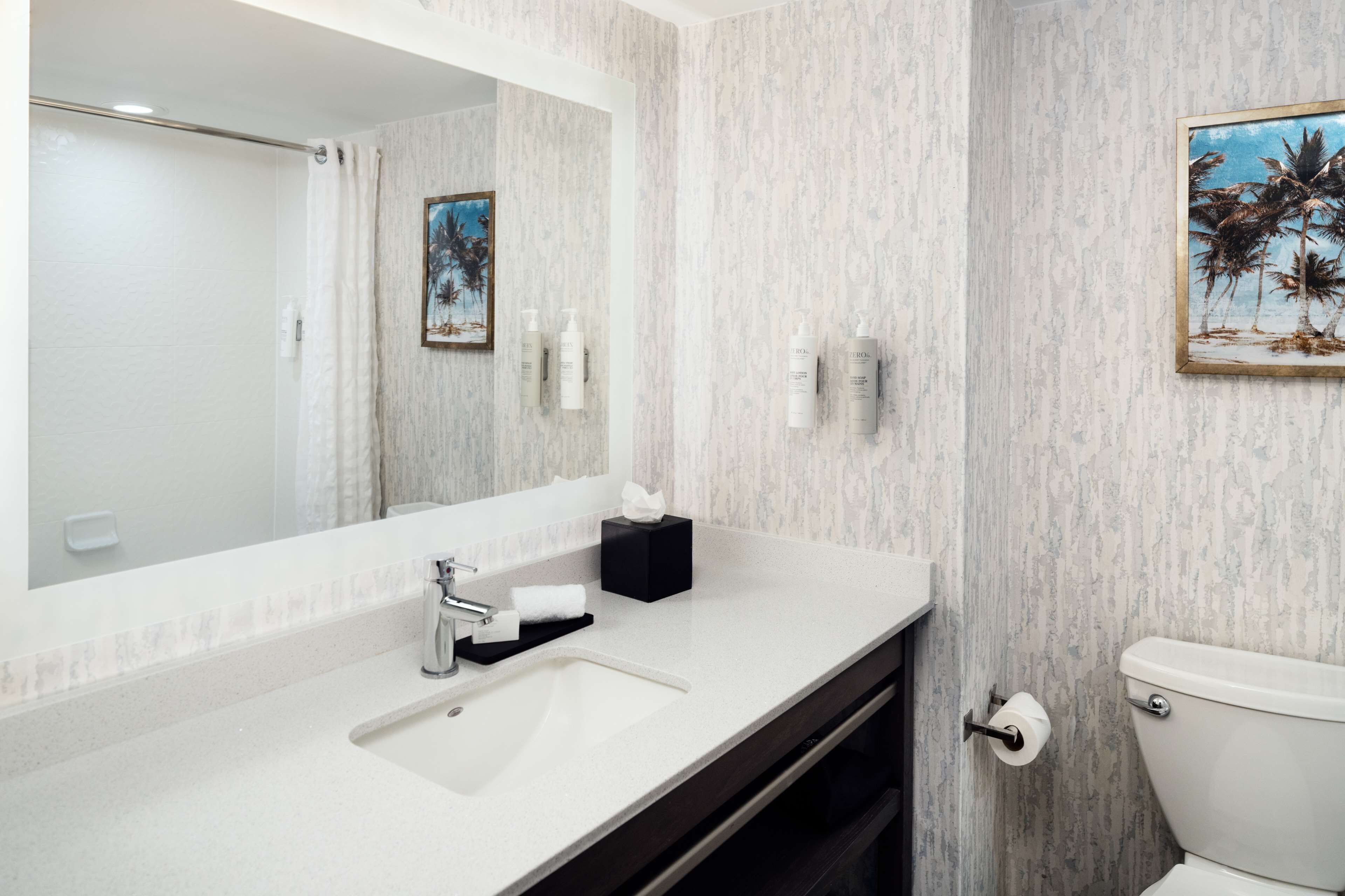 shower, designer toiletries, hair dryer, towels