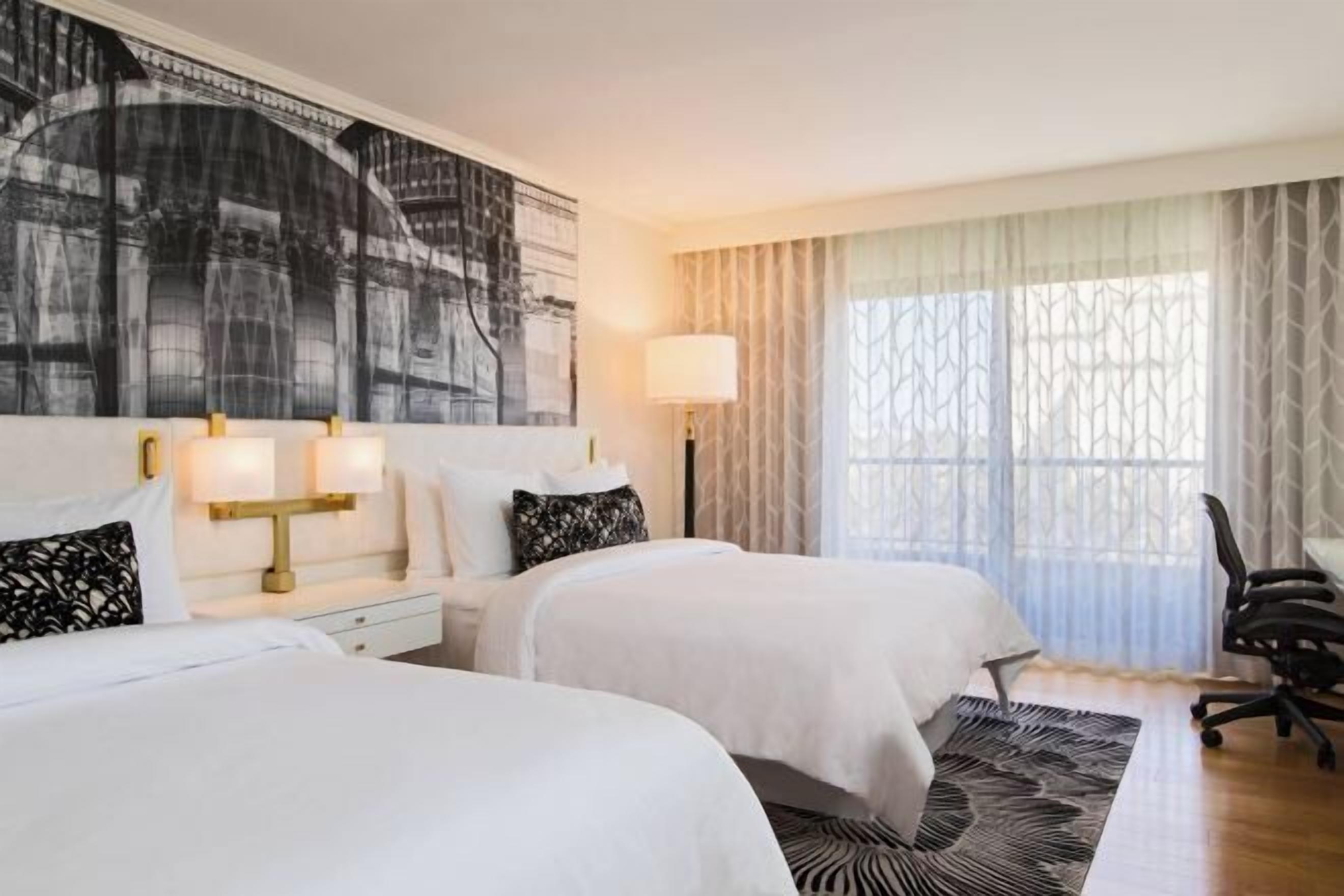 Premium bedding, down comforters, pillowtop beds, minibar