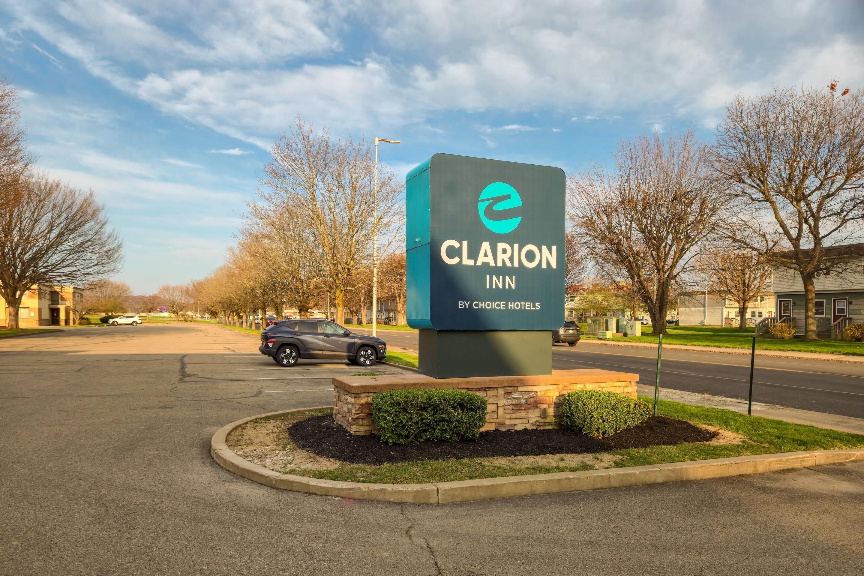 A sign for Clarion Inn by Choice Hotels.