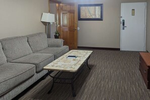 Suite, 1 King Bed with Sofa bed, Non Smoking (Exterior Corridor) | Desk, iron/ironing board, cribs/infant beds, rollaway beds