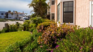 A residential building with a well-maintained garden in front. - Channel Island Shores (Oxnard)