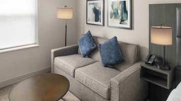Premium bedding, desk, laptop workspace, iron/ironing board