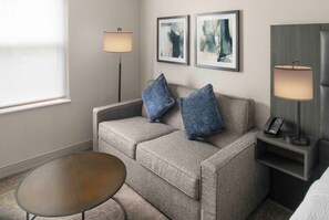 Premium bedding, desk, laptop workspace, iron/ironing board