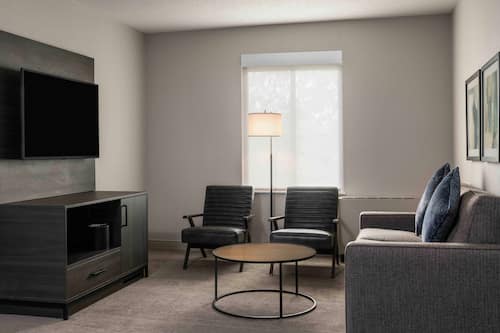 Premium bedding, desk, laptop workspace, iron/ironing board