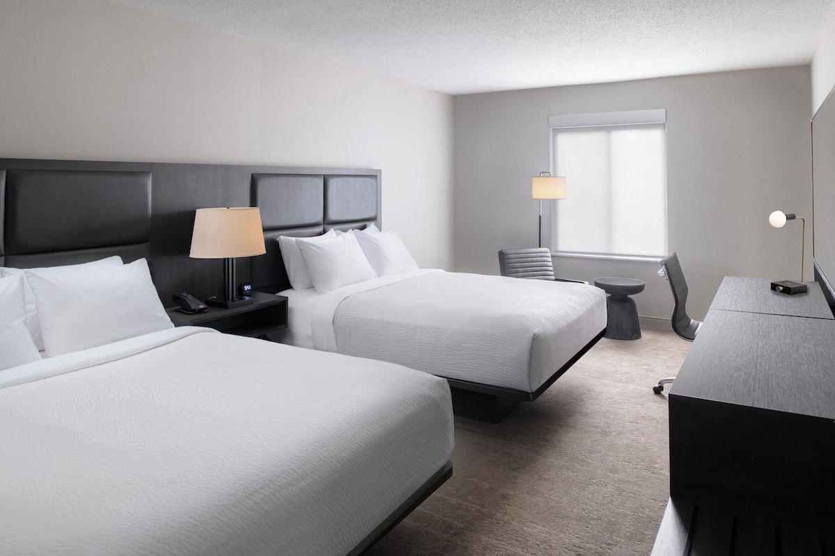 Premium bedding, desk, laptop workspace, iron/ironing board