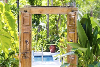 4 outdoor pools, pool umbrellas, sun loungers at Parrot Key Hotel & Villas