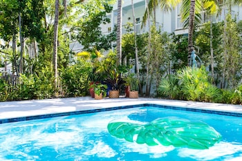 4 outdoor pools, pool umbrellas, sun loungers at Parrot Key Hotel & Villas