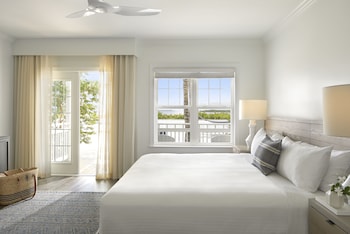 Premium bedding, minibar, in-room safe, individually decorated at Parrot Key Hotel & Villas