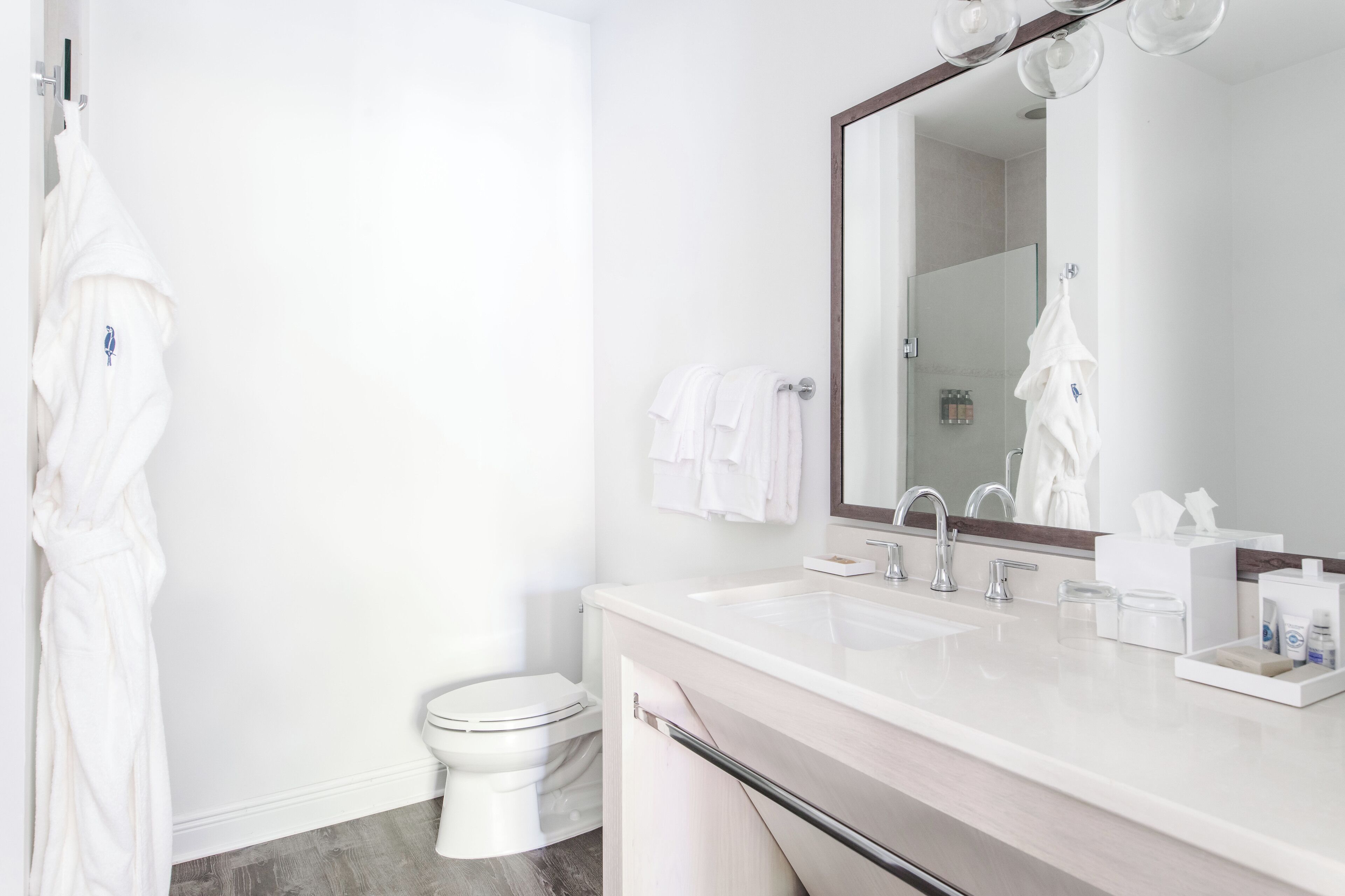 shower, designer toiletries, hair dryer, towels