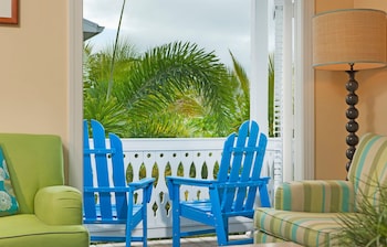 Premium bedding, minibar, in-room safe, individually decorated at Parrot Key Hotel & Villas