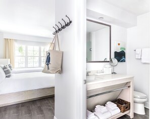 Shower, designer toiletries, hair dryer, towels